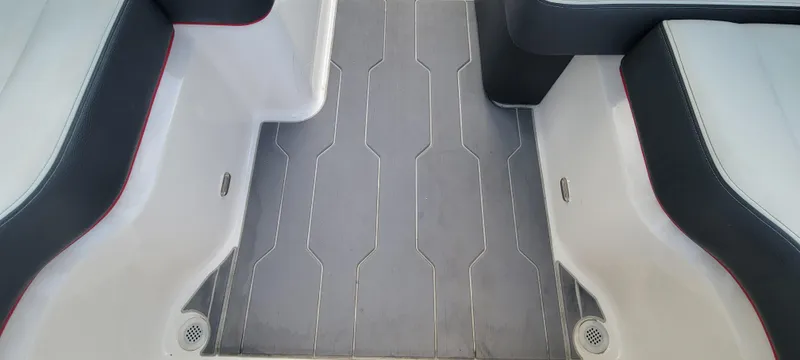 Slide: The Image of 2021 Regal LS2 boat interior with sleek seating and modern flooring design. - 34