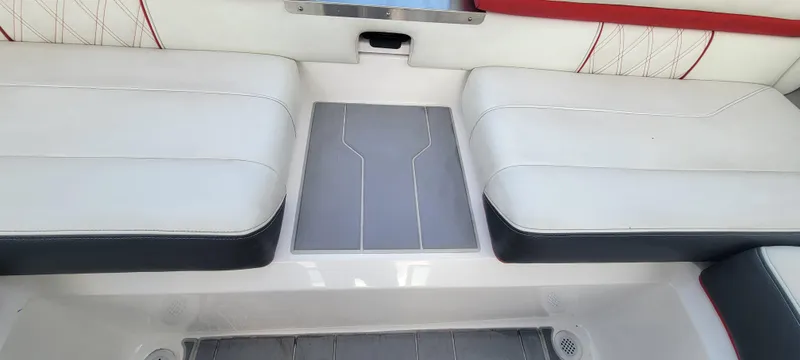 Slide: The Image of 2021 Regal LS2 boat interior with white and red seating. - 39