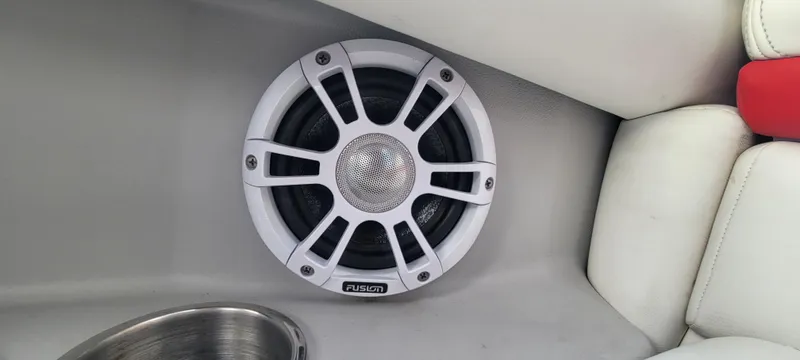 Slide: The Image of Boat speaker in a 2021 Regal LS2, white interior with cup holder. - 44