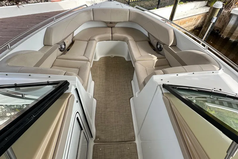 Slide: The Image of 2009 Formula 310 Bowrider with spacious seating and elegant interior design. - 7