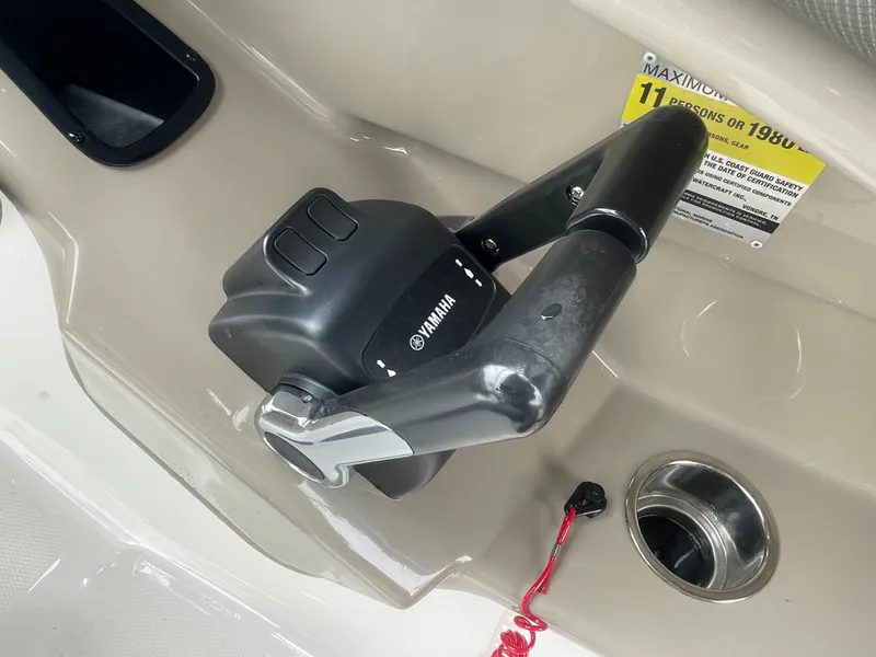 Slide: The Image of Yamaha Boats 2020 242 Limited S throttle control, beige interior, safety lanyard visible. - 10