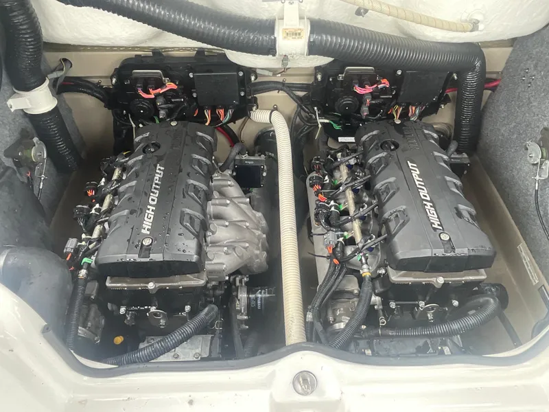 Slide: The Image of 2020 Yamaha Boats 242 Limited S engine compartment with dual high-output engines. - 17