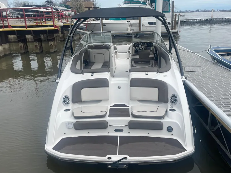 Slide: The Image of 2020 Yamaha Boats 242 Limited S, white and gray, docked at a marina. - 4