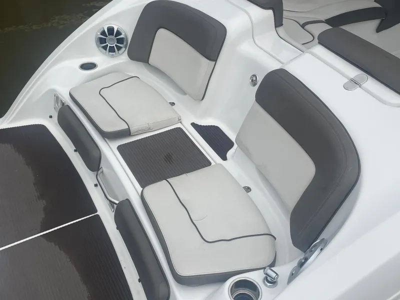 Slide: The Image of 2020 Yamaha Boats 242 Limited S interior seating with cushioned seats and speaker. - 5