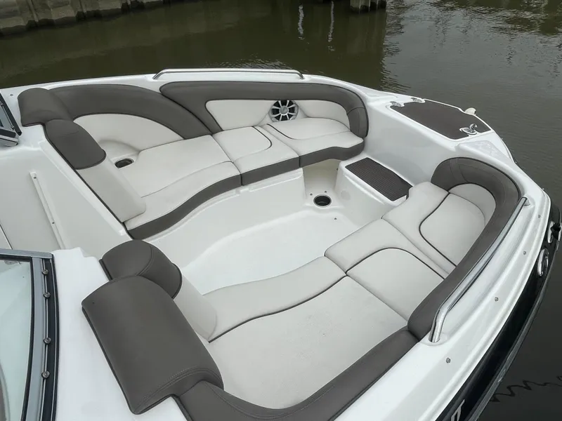 Slide: The Image of 2020 Yamaha Boats 242 Limited S interior with spacious seating and modern design. - 6