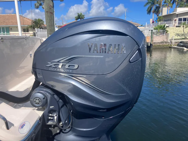 Slide: The Image of Yamaha XTO Offshore engine on 2020 Grady-White Canyon 336 boat, docked by waterfront homes. - 12