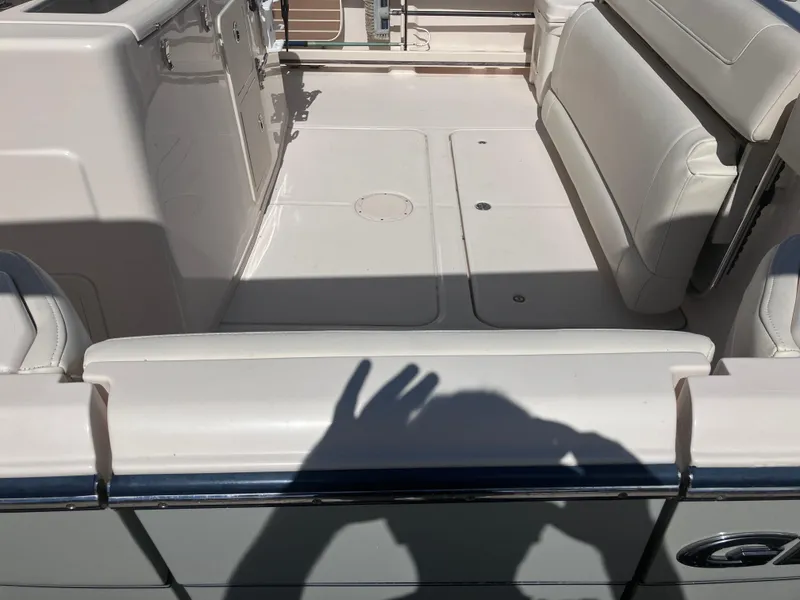 Slide: The Image of 2020 Grady-White Canyon 336 boat interior with white seating and shadow. - 16