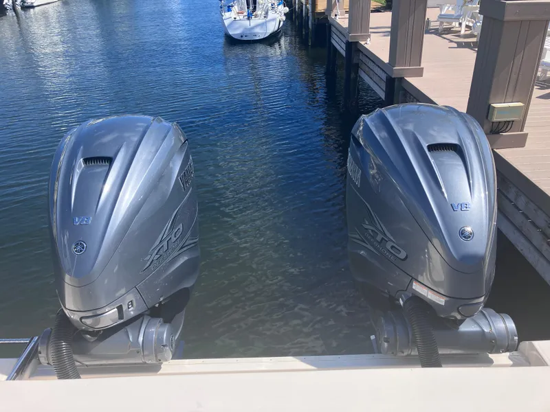 Slide: The Image of Twin Yamaha outboard engines on a 2020 Grady-White Canyon 336 boat at a dock. - 17