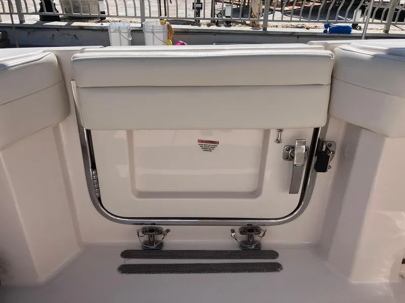 Slide: The Image of 2020 Grady-White Canyon 336 boat interior with cushioned seating and stainless steel railing. - 20