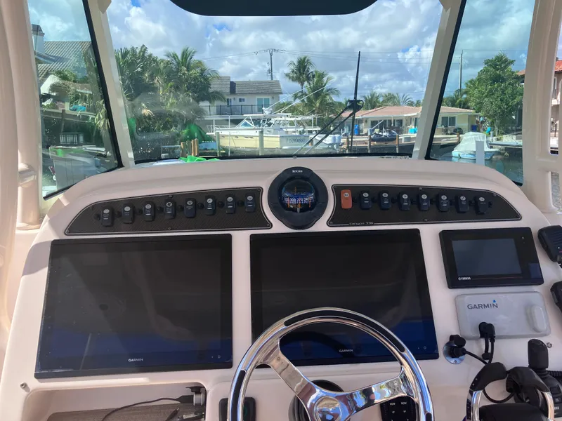 Slide: The Image of 2020 Grady-White Canyon 336 helm with dual screens and Garmin navigation system. - 21