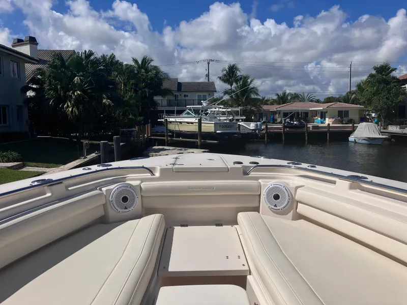 Slide: The Image of 2020 Grady-White Canyon 336 boat docked in a scenic waterfront setting. - 28