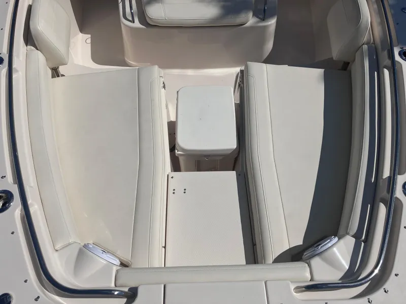 Slide: The Image of 2020 Grady-White Canyon 336 boat interior with cushioned seating and storage. - 31