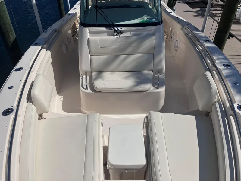 Slide: The Image of 2020 Grady-White Canyon 336 boat interior with white seating and console. - 32