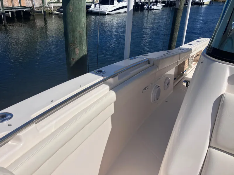 Slide: The Image of 2020 Grady-White Canyon 336 boat docked by the water. - 34