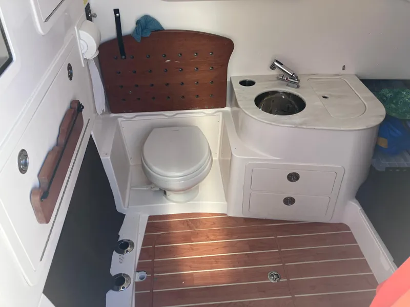 Slide: The Image of 2020 Grady-White Canyon 336 boat interior with toilet and sink. - 36