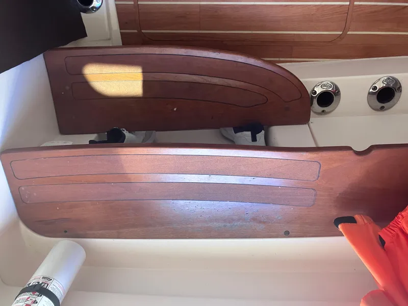 Slide: The Image of 2020 Grady-White Canyon 336 boat interior with wooden paneling and fixtures. - 39