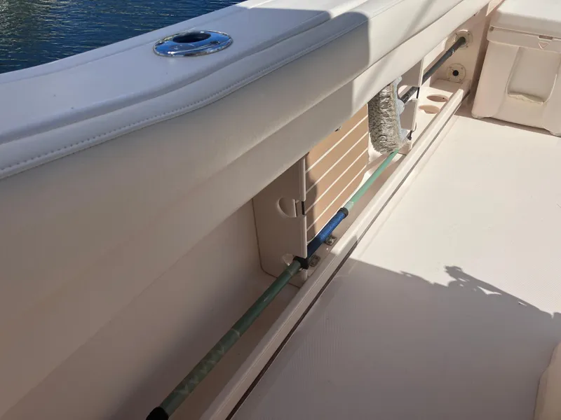 Slide: The Image of 2020 Grady-White Canyon 336 boat interior detail with rod storage. - 45
