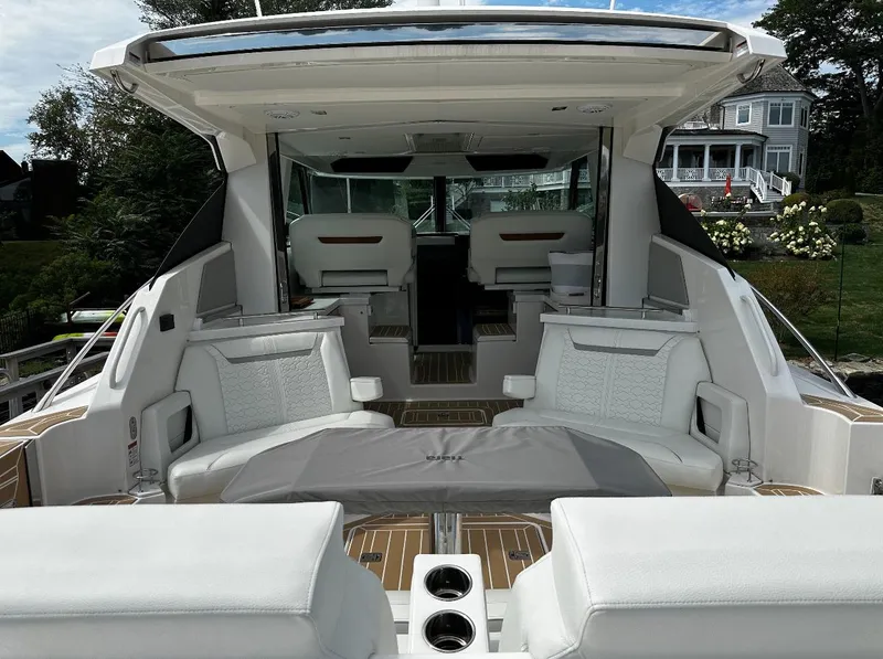 Slide: The Image of 2024 Tiara Yachts 43 LE luxury yacht interior with spacious seating and modern design. - 12