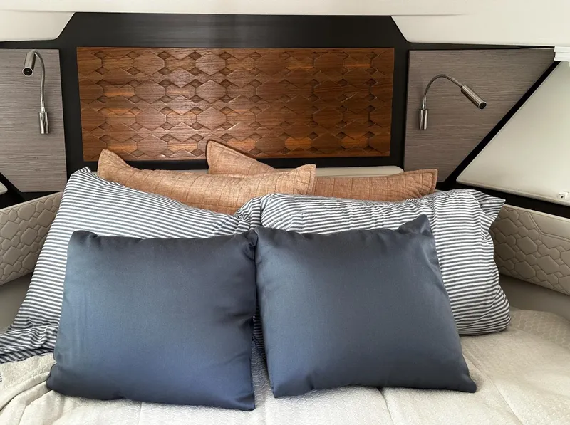 Slide: The Image of Luxurious 2024 Tiara Yachts 43 LE cabin with stylish pillows and modern lighting. - 19