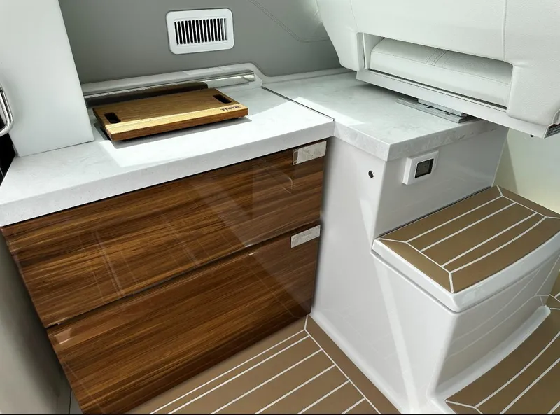 Slide: The Image of 2024 Tiara Yachts 43 LE interior with sleek wood cabinetry and modern design. - 23