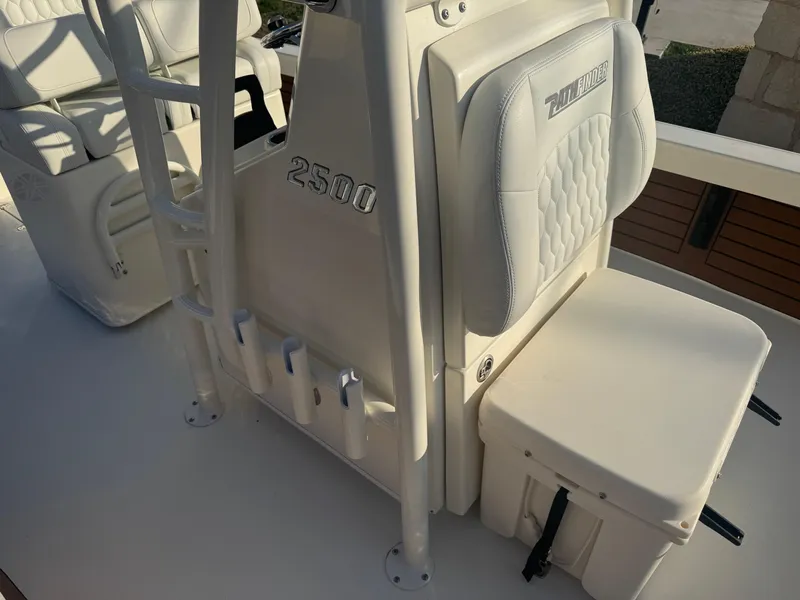 Slide: The Image of 2025 Pathfinder 2500 Hybrid boat interior with cushioned seating and storage. - 10