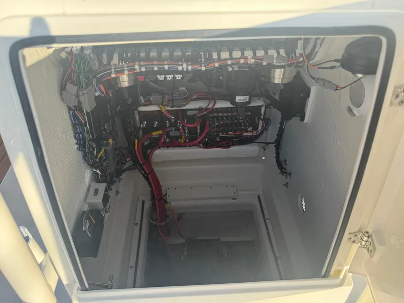 Slide: The Image of Electrical compartment of 2025 Pathfinder 2500 Hybrid boat, showcasing wiring and components. - 12