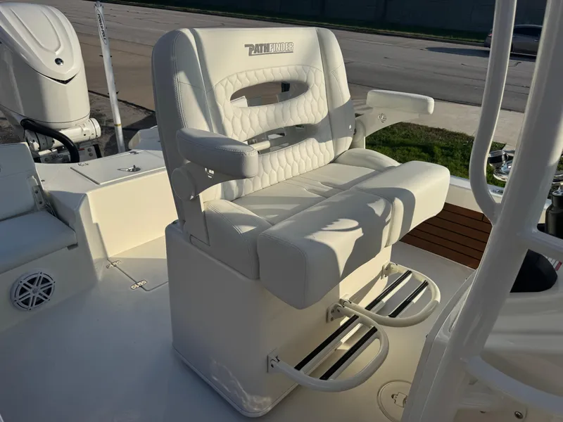 Slide: The Image of Luxury seating on 2025 Pathfinder 2500 Hybrid boat, featuring cushioned armrests and footrests. - 19