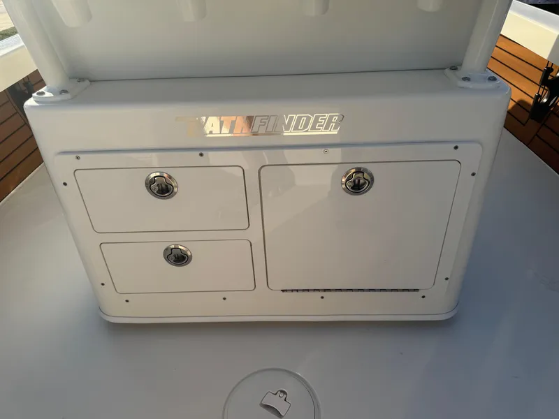 Slide: The Image of 2025 Pathfinder 2500 Hybrid boat storage compartments with secure latches and sleek design. - 20