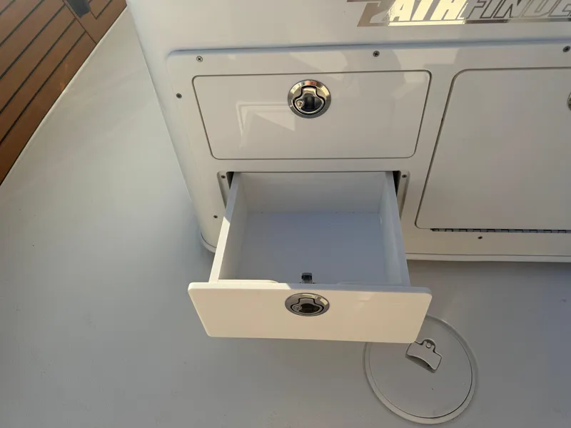 Slide: The Image of Open storage drawer on 2025 Pathfinder 2500 Hybrid boat. - 23
