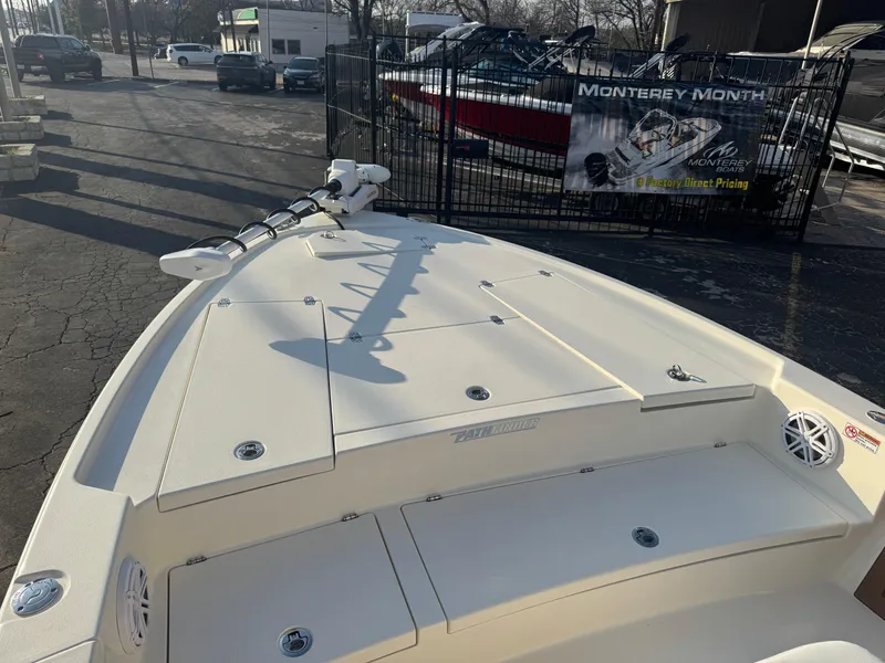 Slide: The Image of 2025 Pathfinder 2500 Hybrid boat deck, featuring a clean, spacious layout in a marina setting. - 24