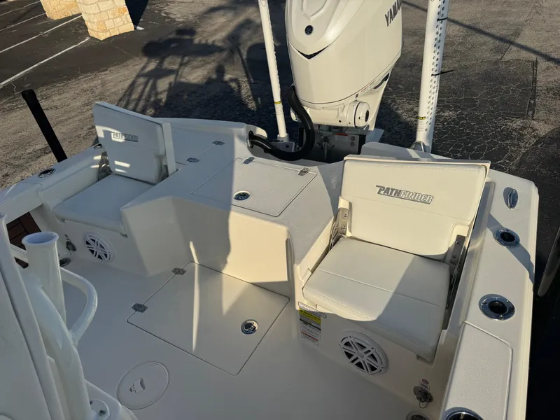 Slide: The Image of 2025 Pathfinder 2500 Hybrid boat interior with seating and Yamaha engine. - 31