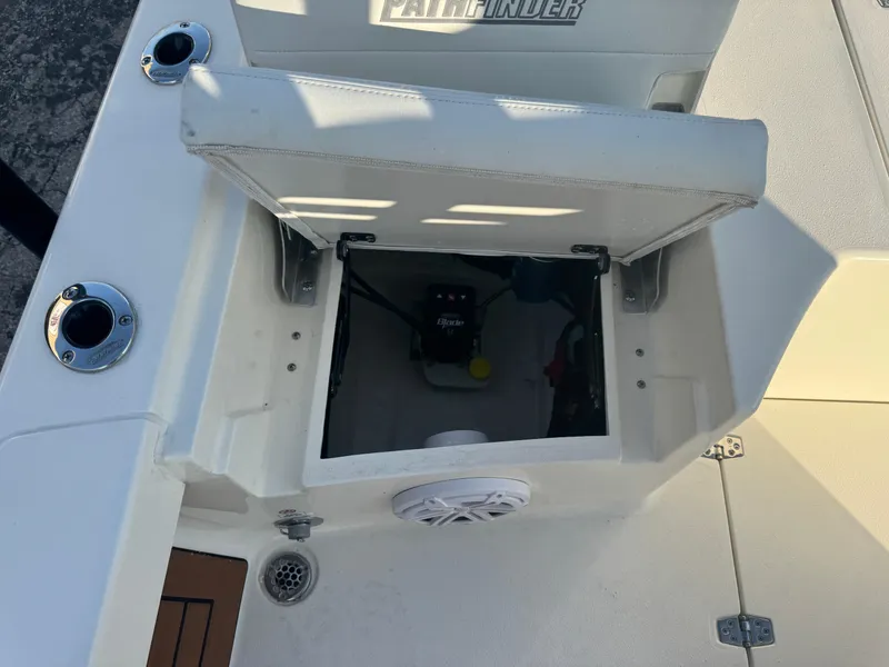 Slide: The Image of Open storage compartment on a 2025 Pathfinder 2500 Hybrid boat deck. - 34