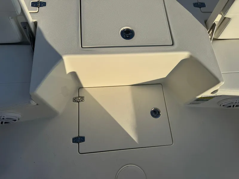 Slide: The Image of 2025 Pathfinder 2500 Hybrid boat deck with storage compartments. - 35