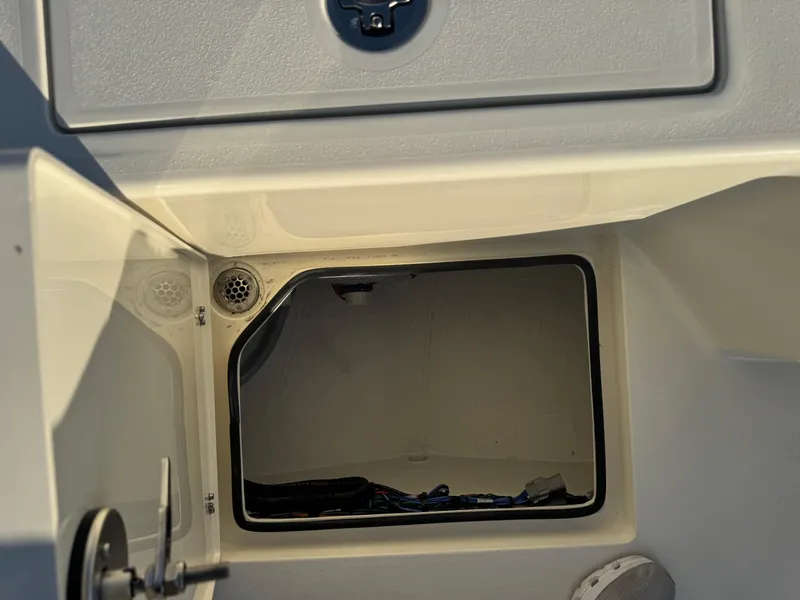 Slide: The Image of Open storage compartment on a 2025 Pathfinder 2500 Hybrid boat. - 36