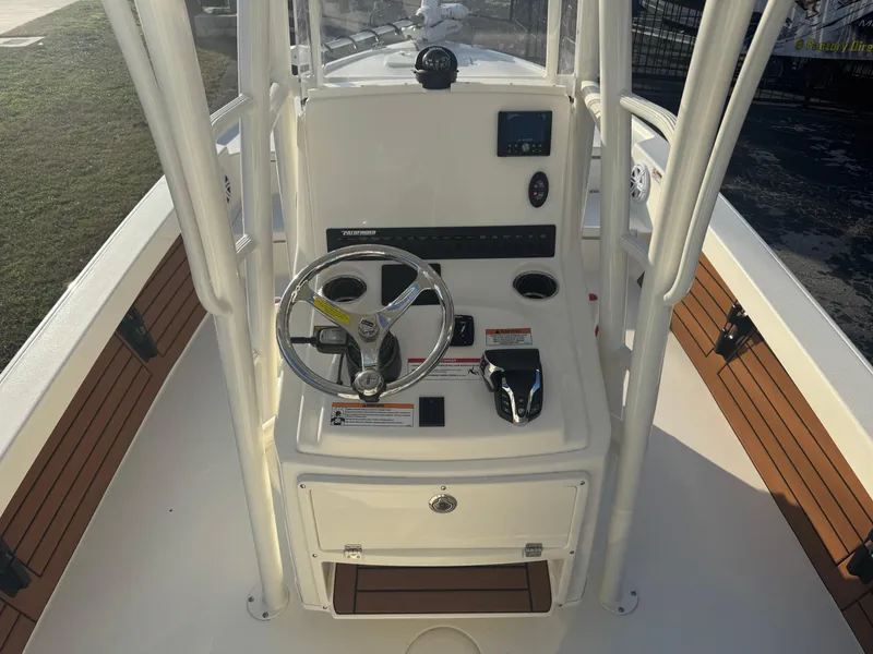 Slide: The Image of 2025 Pathfinder 2500 Hybrid boat console with steering wheel and controls. - 4
