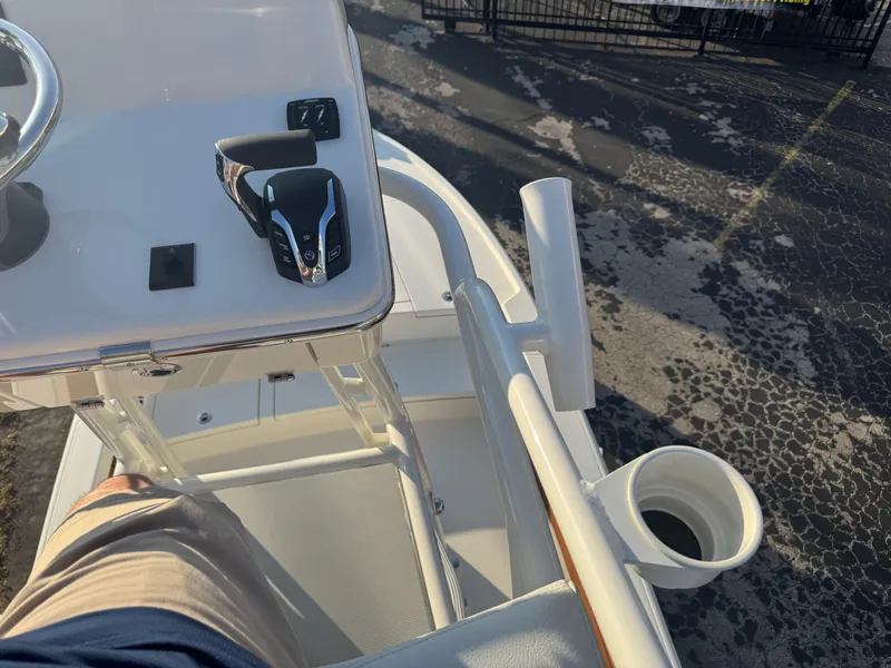 Slide: The Image of 2025 Pathfinder 2500 Hybrid boat console with steering wheel and throttle controls. - 42