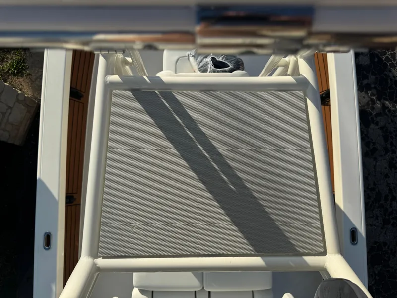 Slide: The Image of Overhead view of 2025 Pathfinder 2500 Hybrid boat deck with seating and mesh cover. - 45
