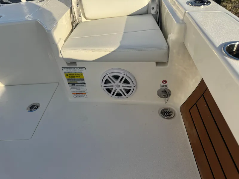 Slide: The Image of 2025 Pathfinder 2500 Hybrid boat interior with seating and speaker detail. - 47