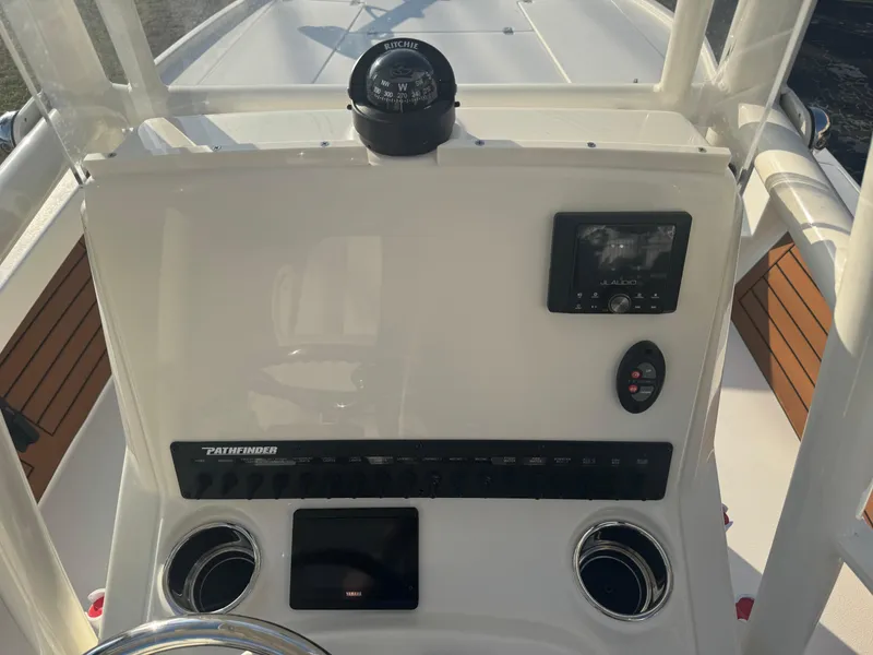 Slide: The Image of 2025 Pathfinder 2500 Hybrid boat dashboard with compass and electronic controls. - 5