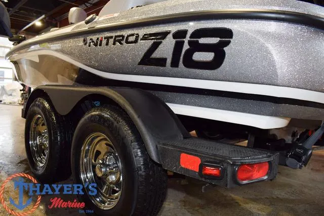 Slide: The Image of 2025 Nitro Z18 Pro boat on trailer at Thayer's Marine showroom. - 10