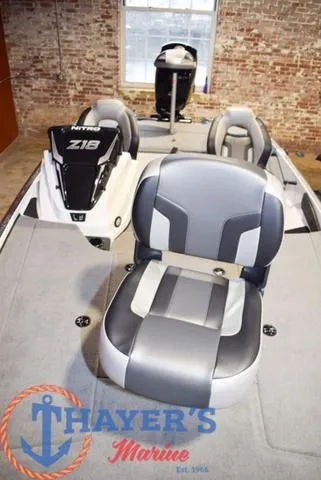 Slide: The Image of 2025 Nitro Z18 Pro boat interior with seating, showcased at Thayer's Marine. - 11
