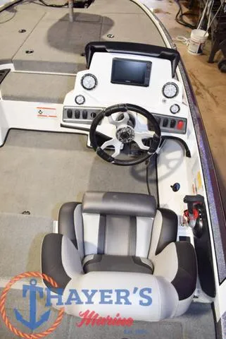 Slide: The Image of Interior of a 2025 Nitro Z18 Pro boat with steering wheel and dashboard. - 14