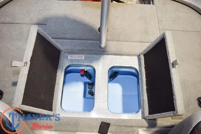 Slide: The Image of Open storage compartments on a 2025 Nitro Z18 Pro boat deck. - 15