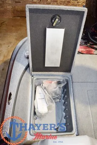 Slide: The Image of Open storage compartment in a 2025 Nitro Z18 Pro boat. - 16