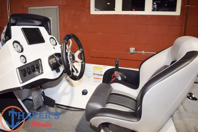 Slide: The Image of Interior of a 2025 Nitro Z18 Pro boat, featuring steering wheel and dashboard controls. - 19