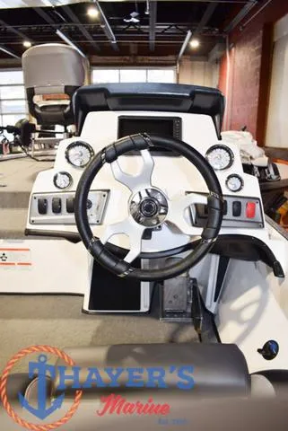 Slide: The Image of 2025 Nitro Z18 Pro boat dashboard with steering wheel in showroom. - 20