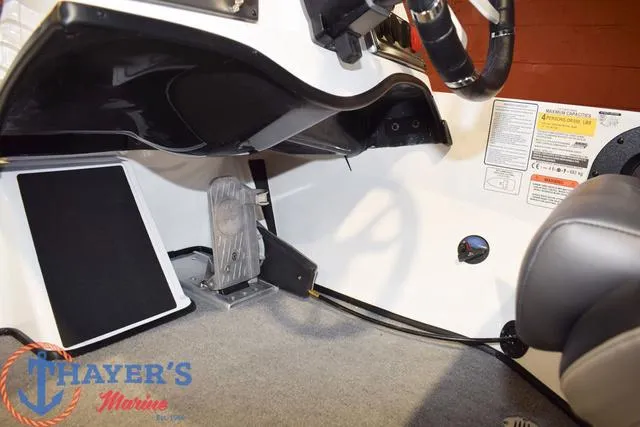 Slide: The Image of Interior of a 2025 Nitro Z18 Pro boat, featuring steering and pedal controls. - 21