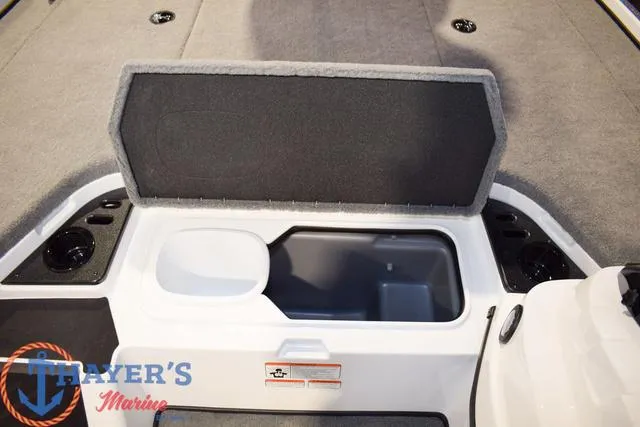 Slide: The Image of Open storage compartment in a 2025 Nitro Z18 Pro boat, featuring carpeted interior. - 23