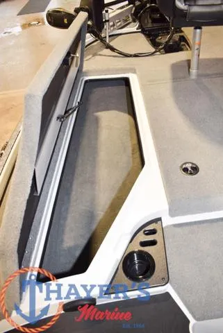 Slide: The Image of 2025 Nitro Z18 Pro boat storage compartment with Thayer's Marine logo. - 25