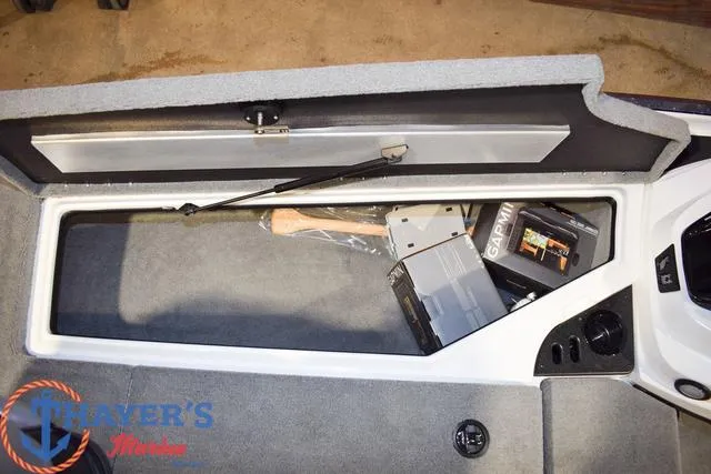 Slide: The Image of Open storage compartment in a 2025 Nitro Z18 Pro boat with Garmin electronics. - 26